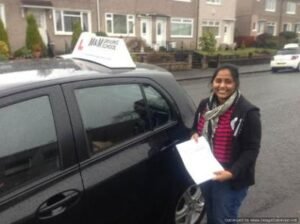 The Benefits of Automatic Cars: A Smart Choice for Modern Drivers Driving student holding test result