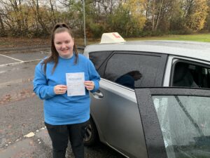 learner holding pass certificate M&M driving school 4