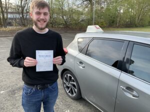 learner hoding the pass certificate